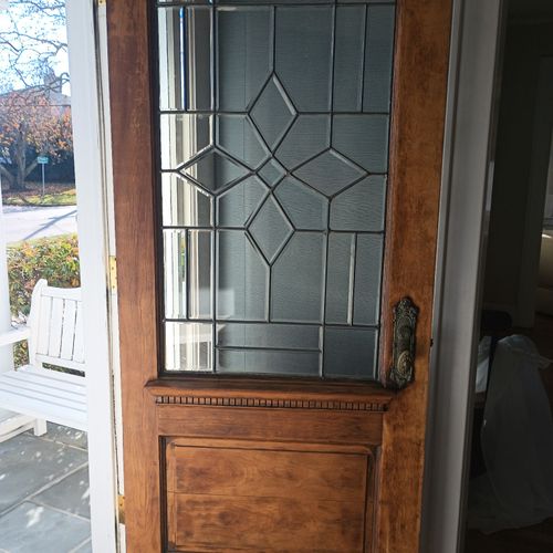 AFTER: Wood door restoration and glass repair on l