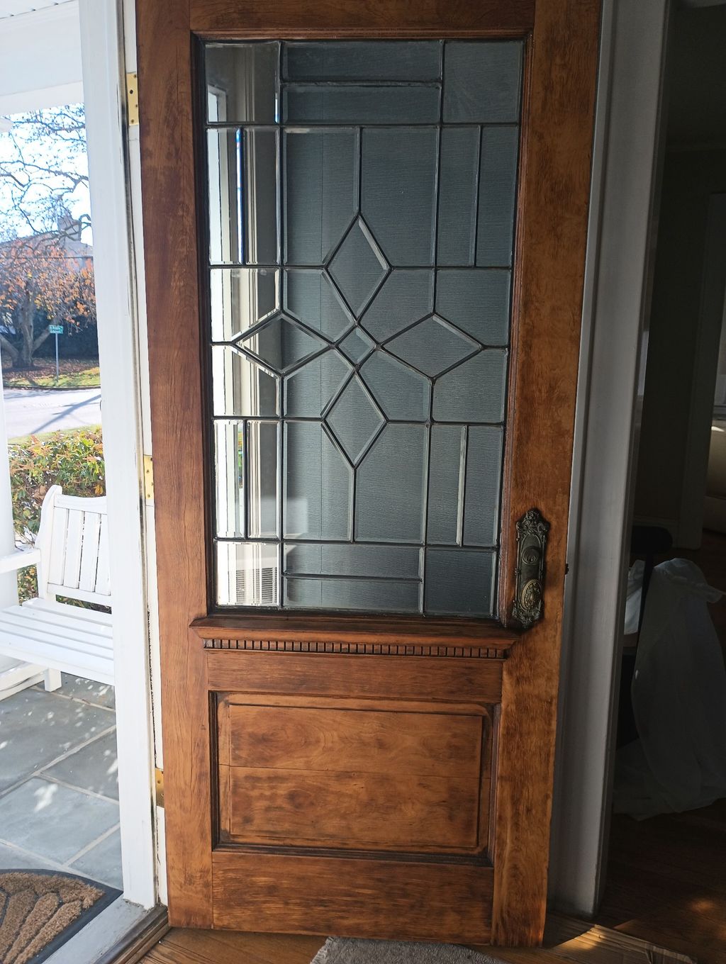 AFTER: Wood door restoration and glass repair on l