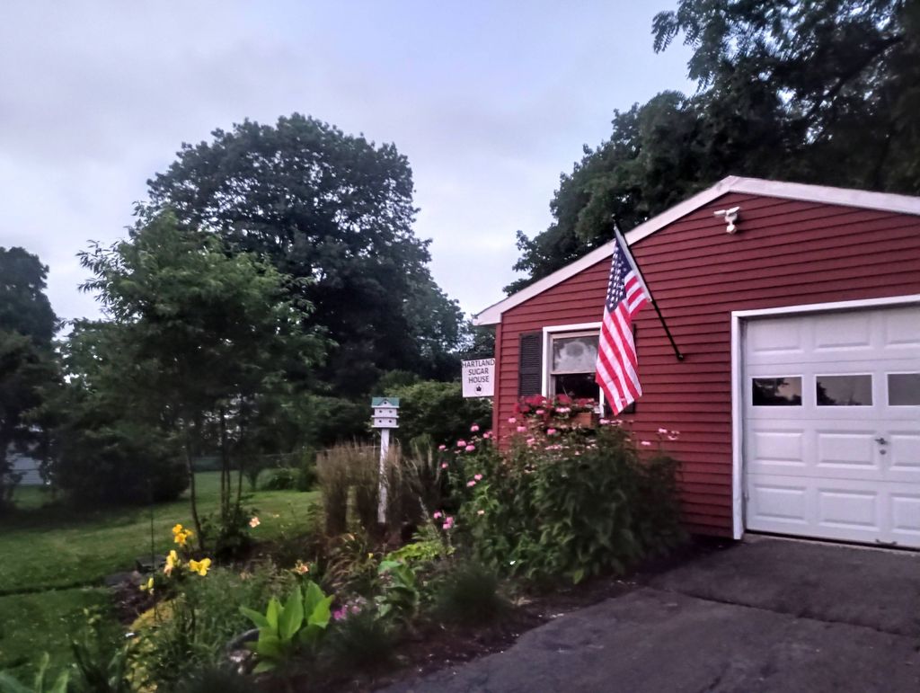 Painting of vinyl sided garage, perennial planting