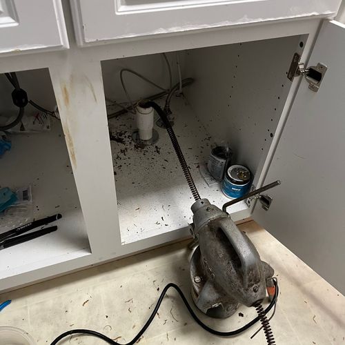 Unclogging a kitchen sink drain 