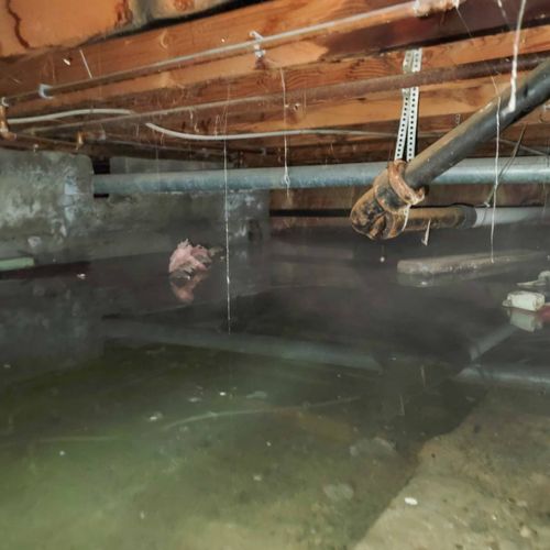 A large amount of standing water underneath a home