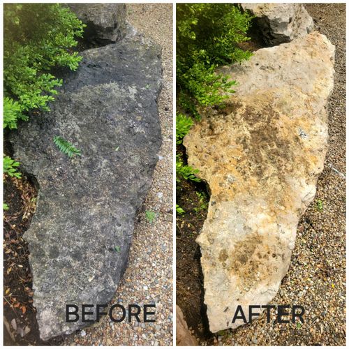 Limestone boulders restored by pressure washing. 