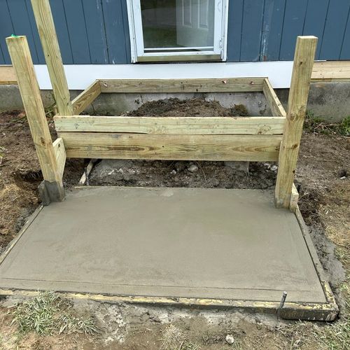 Frame and concrete pad for new stairs and landing.