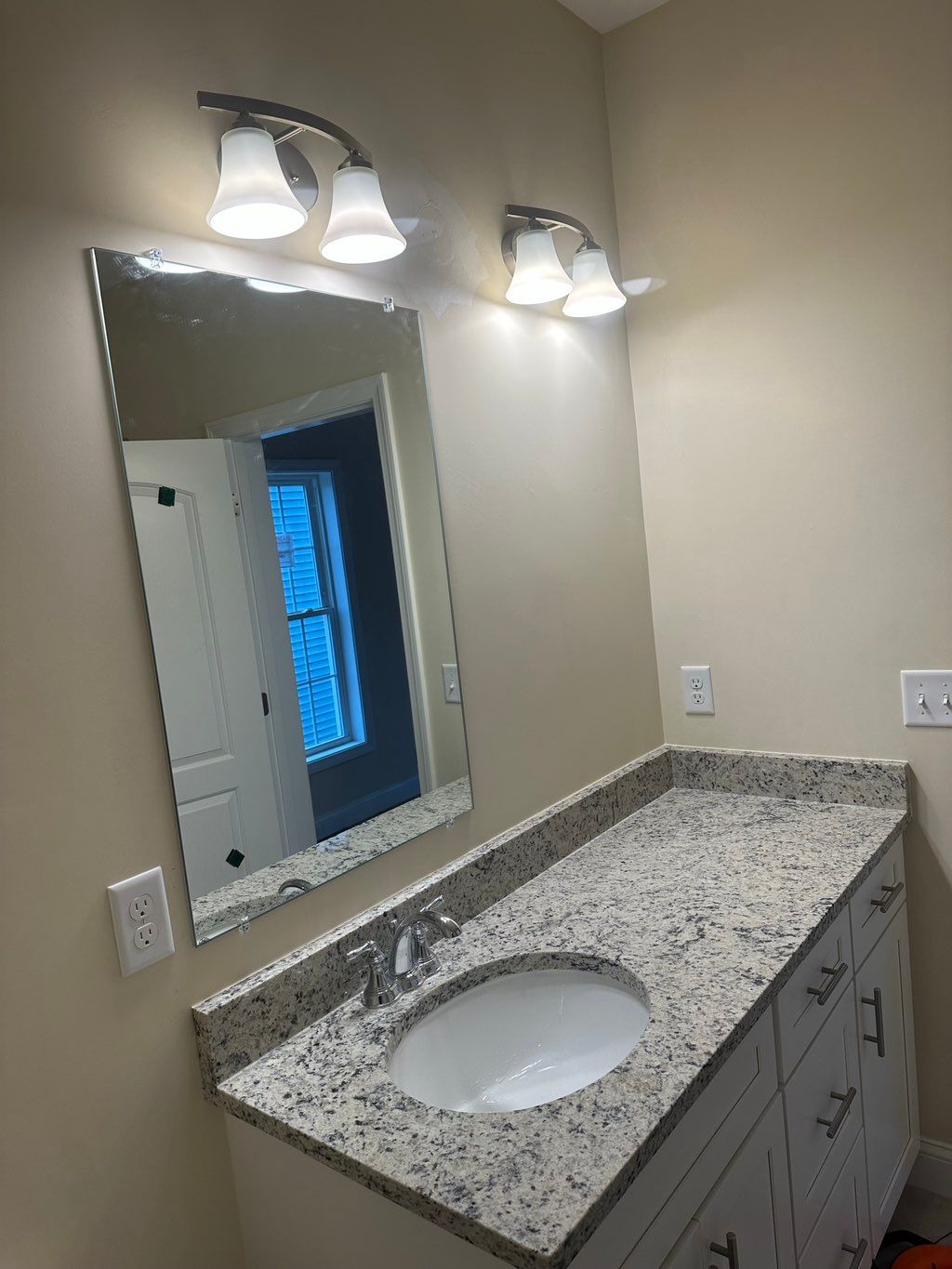 Installation of Vanity lights.