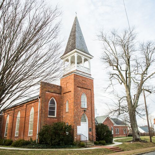 Cedar roofing on a historic church steeple. 