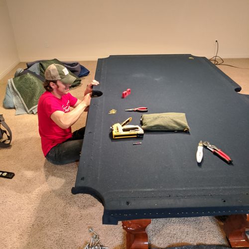 Manly Movers assembling a pool table