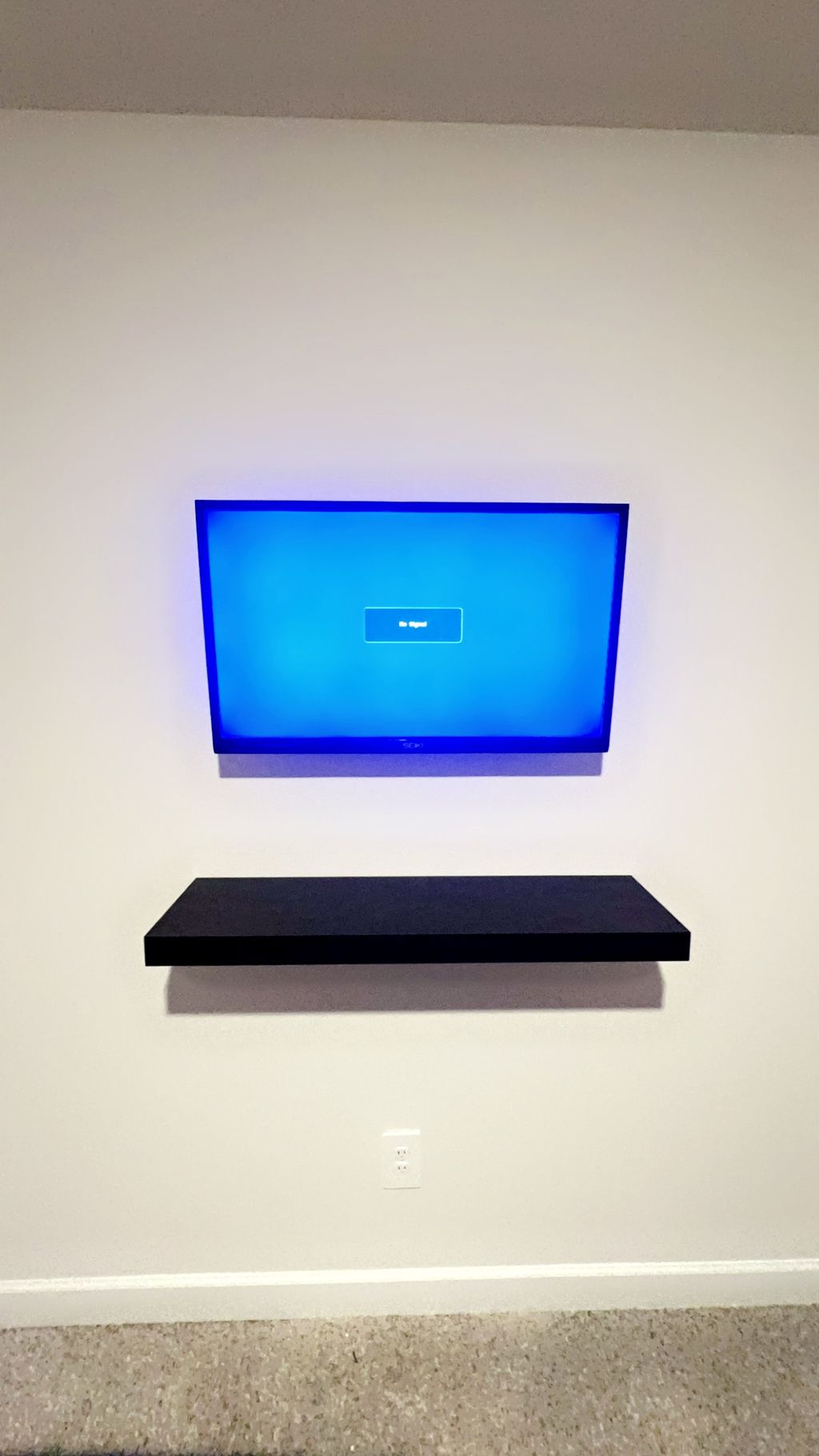 Wireless tv mount and floating shelf.