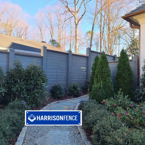 Custom Wood Fence Installed and Stained by Harriso