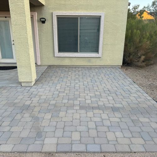 Pavers with oil stains before pressure washing. 