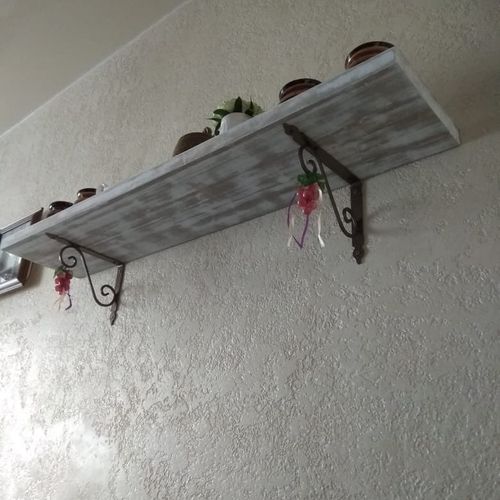 A shelf was made with the effect of worn old wood.