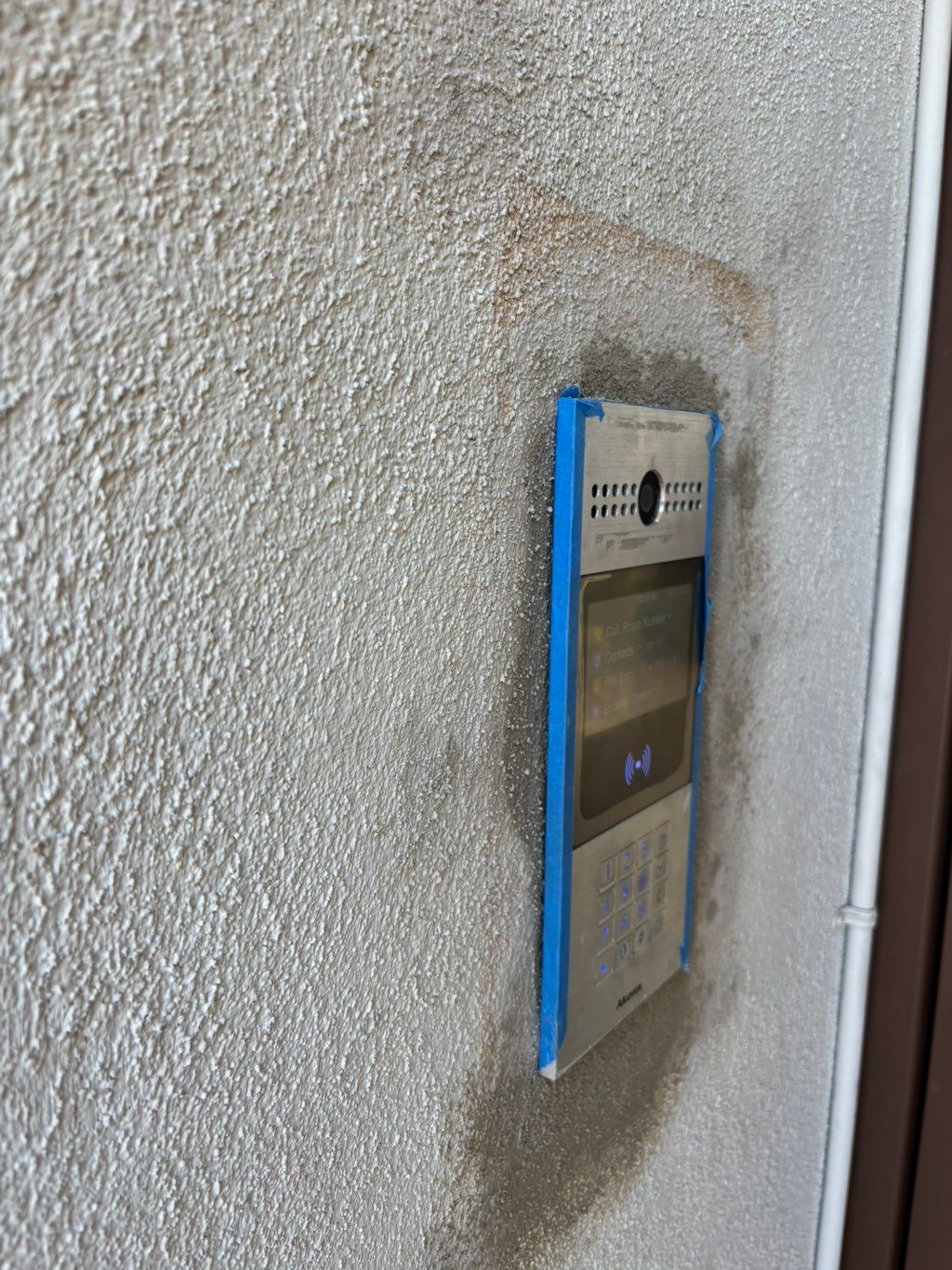 Recessed phone box installation and stucco patchin