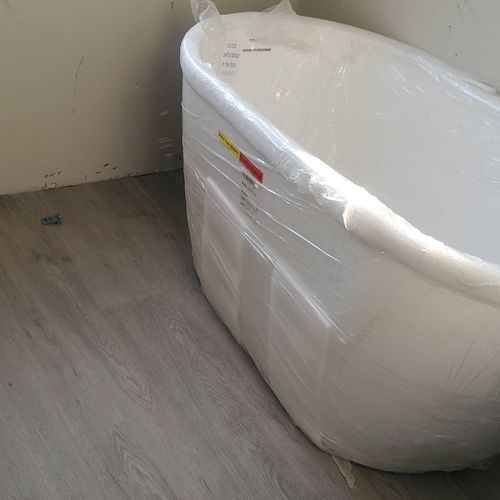 installed floors, tub with a Roman Faucet 