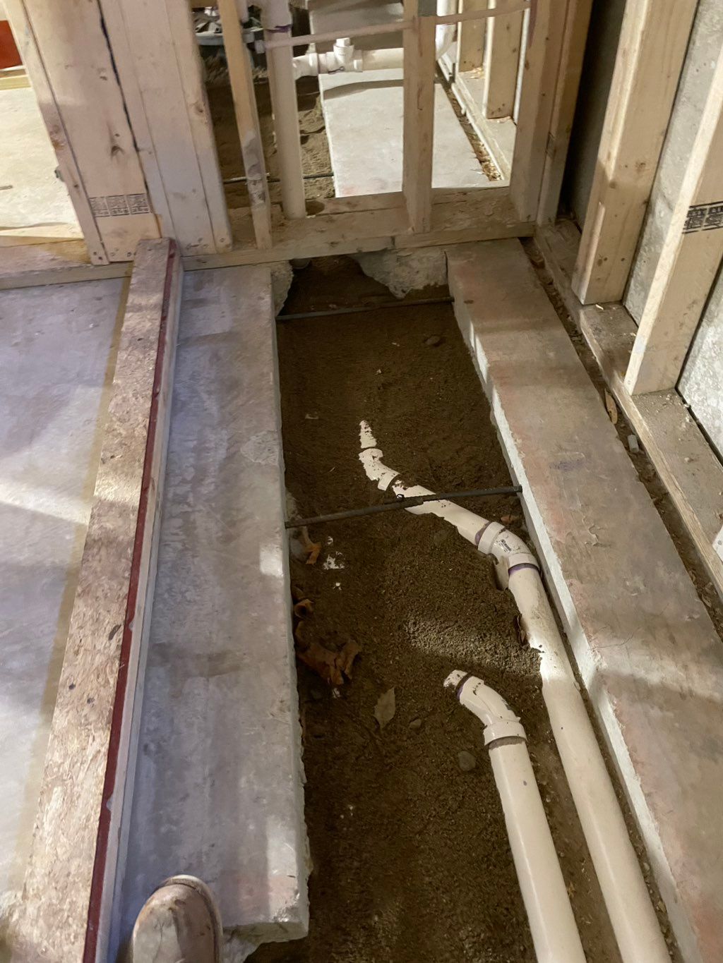 Prep to pour new concrete slab floor inside of a b