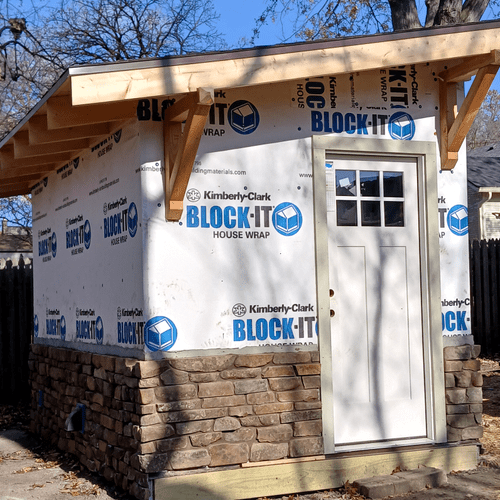 Custom outdoor sauna with stone 