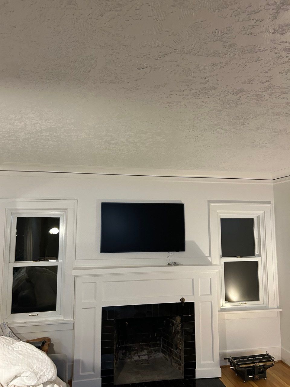 The Frame TV securely mounted on a plastic wall.
