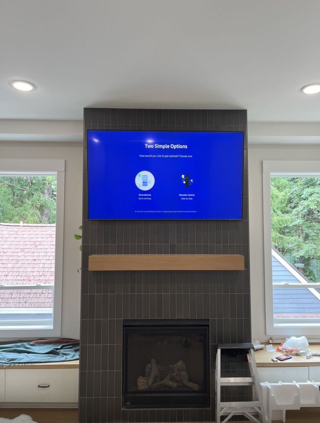 Mountin 65 inch TV over fireplace on a tile