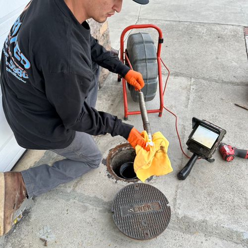 Sewer inspection through floor clean-out access.