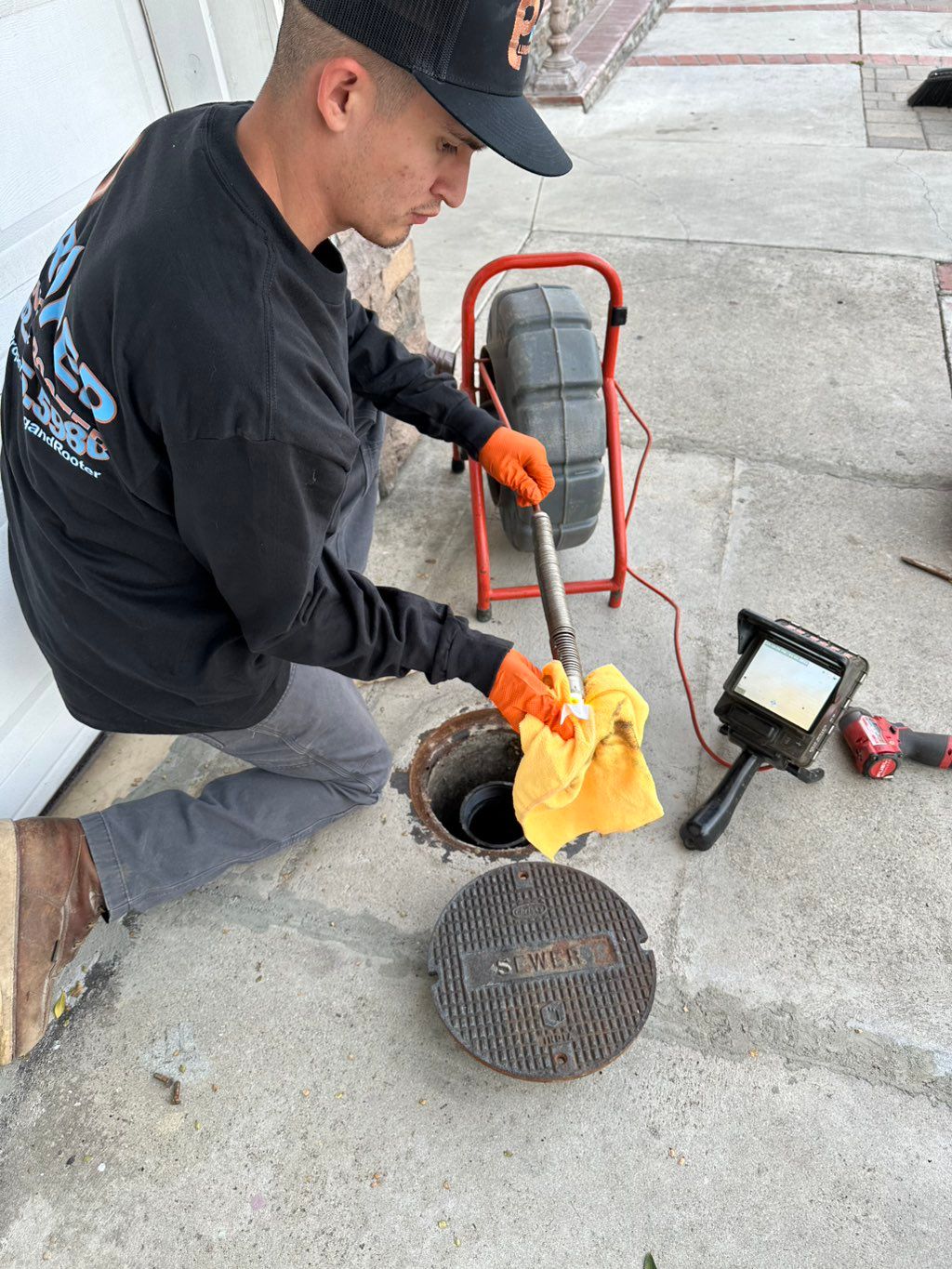 Sewer inspection through floor clean-out access.