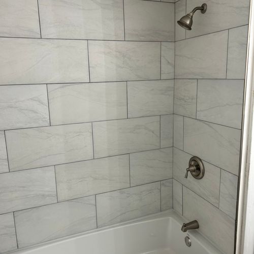 Shower tile, tub installed, fixtures, floors, vani