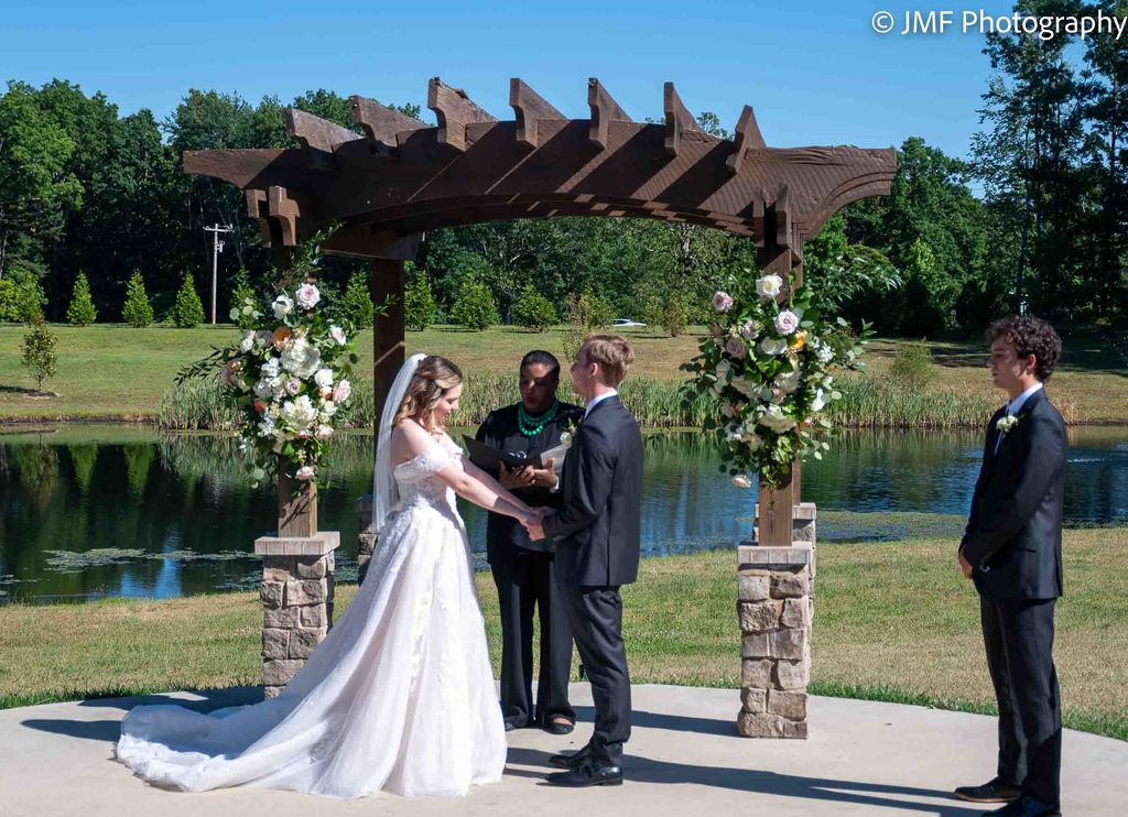 Bride and groom at the alter at Homestead Manor in