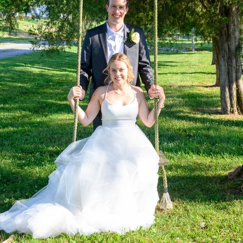 Groom pushing bride on swing at Magnolia Farm Eagl