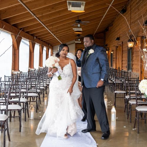 Bride and groom posing for photos at The Barn at S