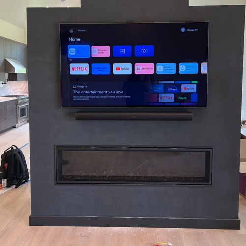 TV and soundbar install over fireplace