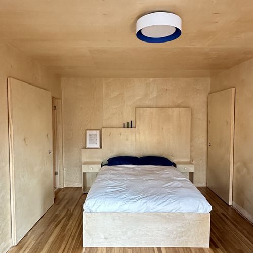 Straight view of bedroom area - headboard and bed 