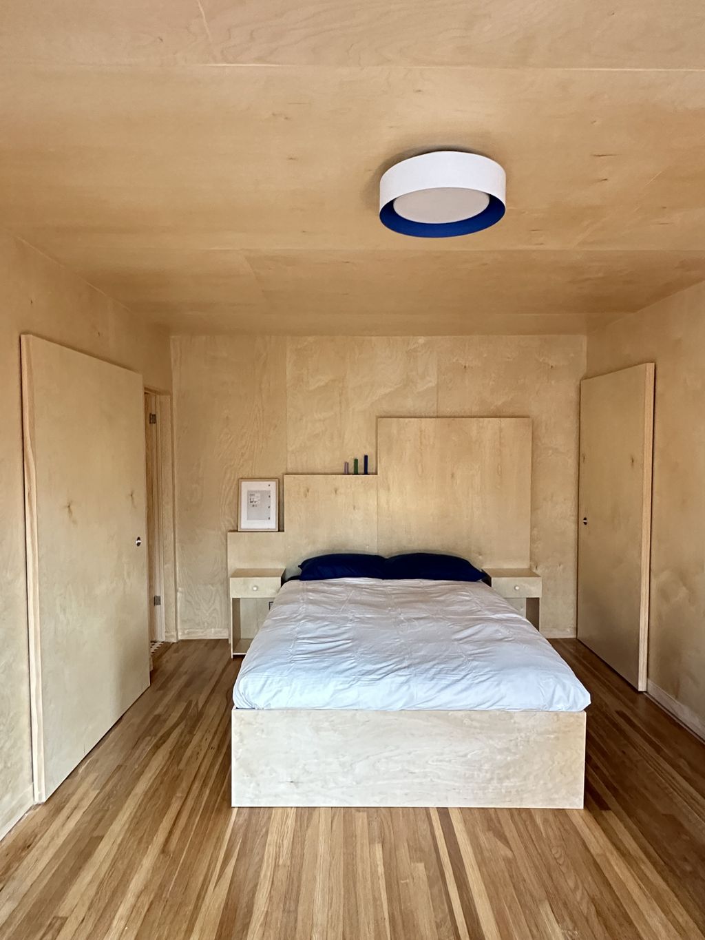 Straight view of bedroom area - headboard and bed 