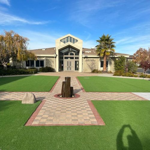 Artificial Turf, paver cross, and basalt fountain 