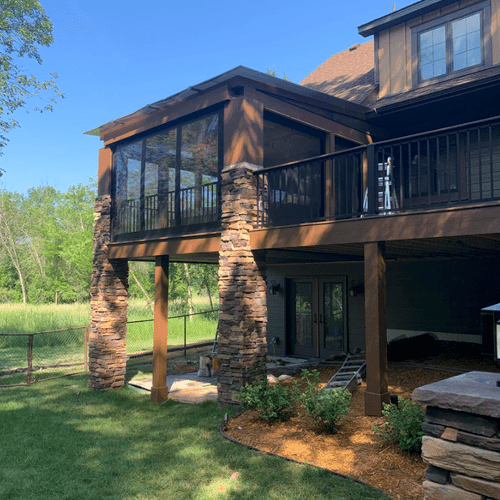 3 Season Porch with stone and motorized screens