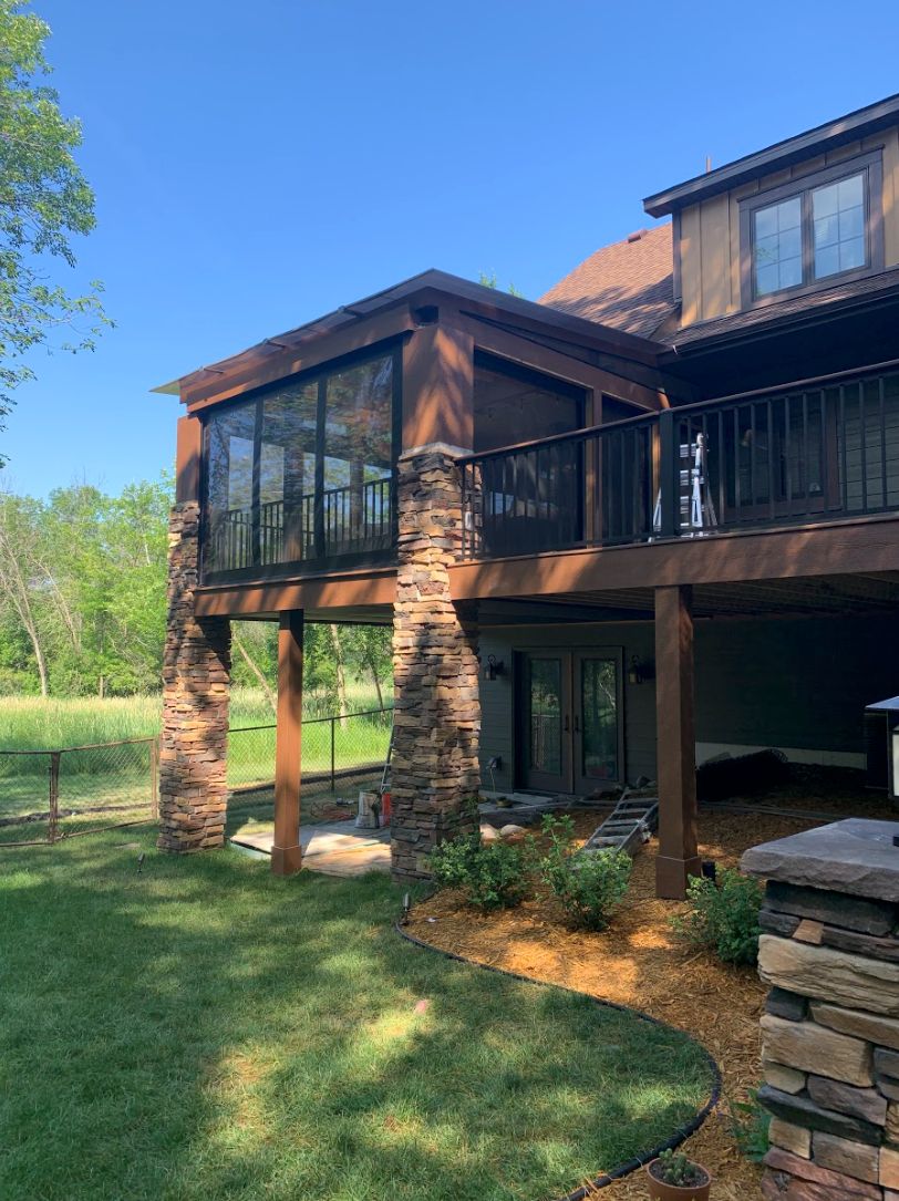 3 Season Porch with stone and motorized screens