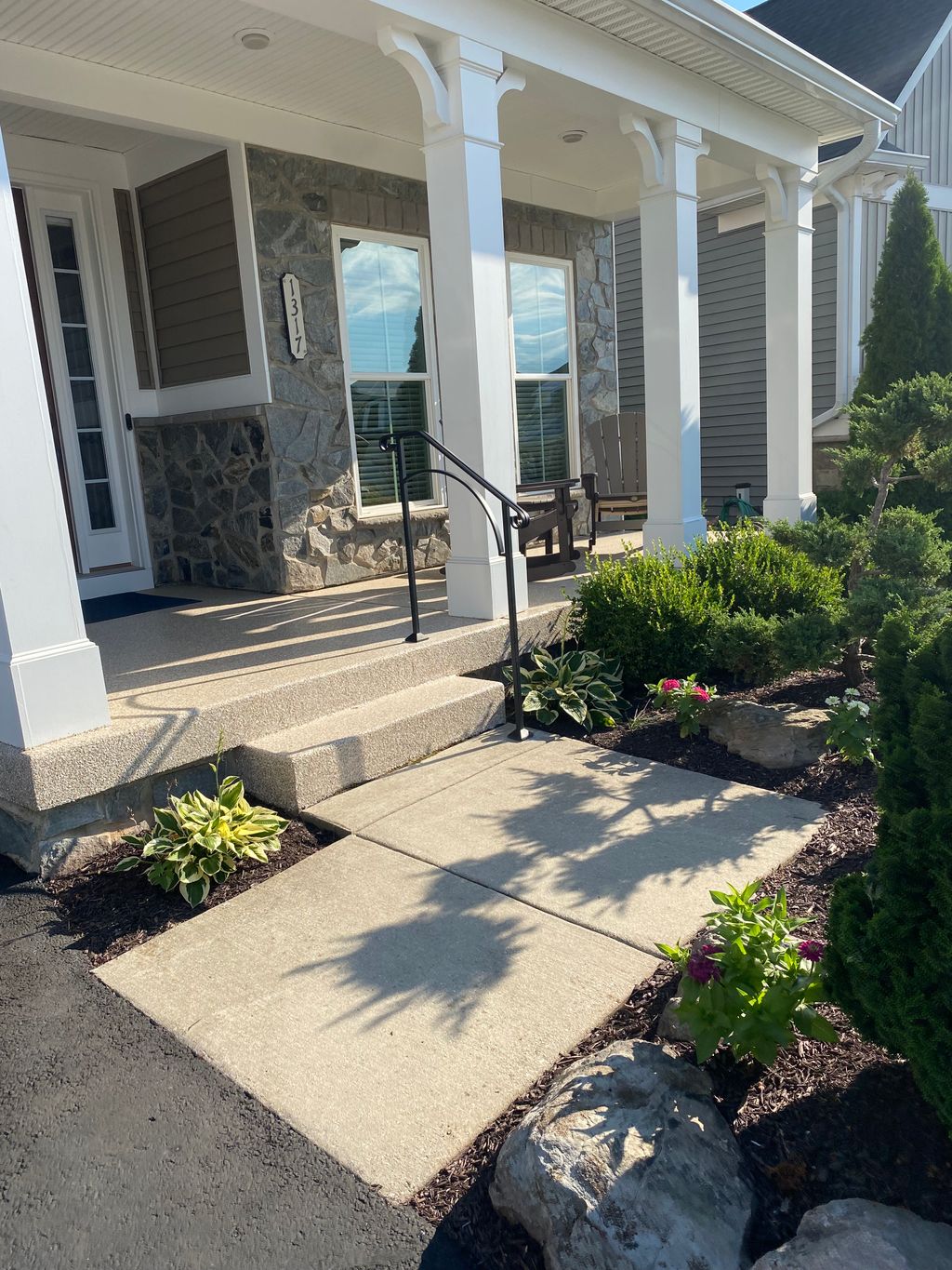 An exterior handrail for navigating the stairs