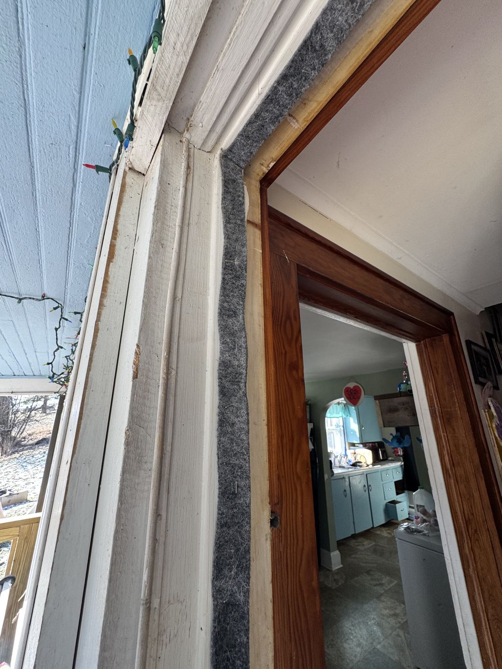 Removed and installed new door weather stripping -