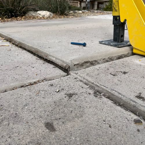 Crew leveling a driveway 