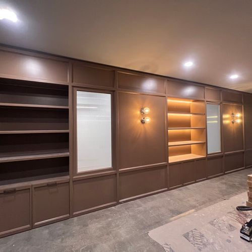 Custom wall, built in shelving, custom doors, and 