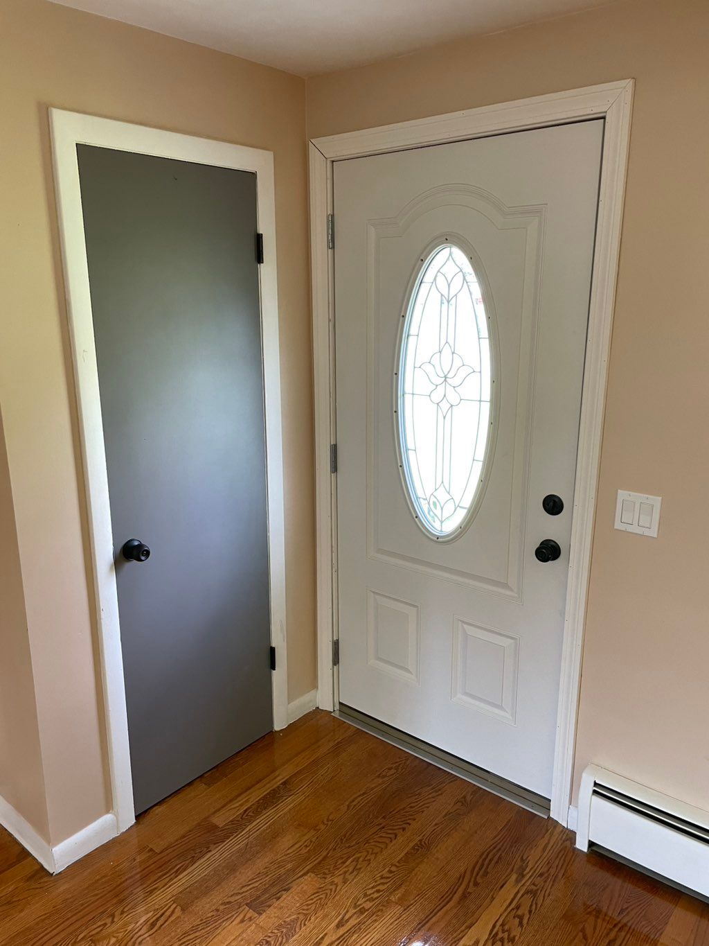 Installed new front entry door, lockset, and trim.