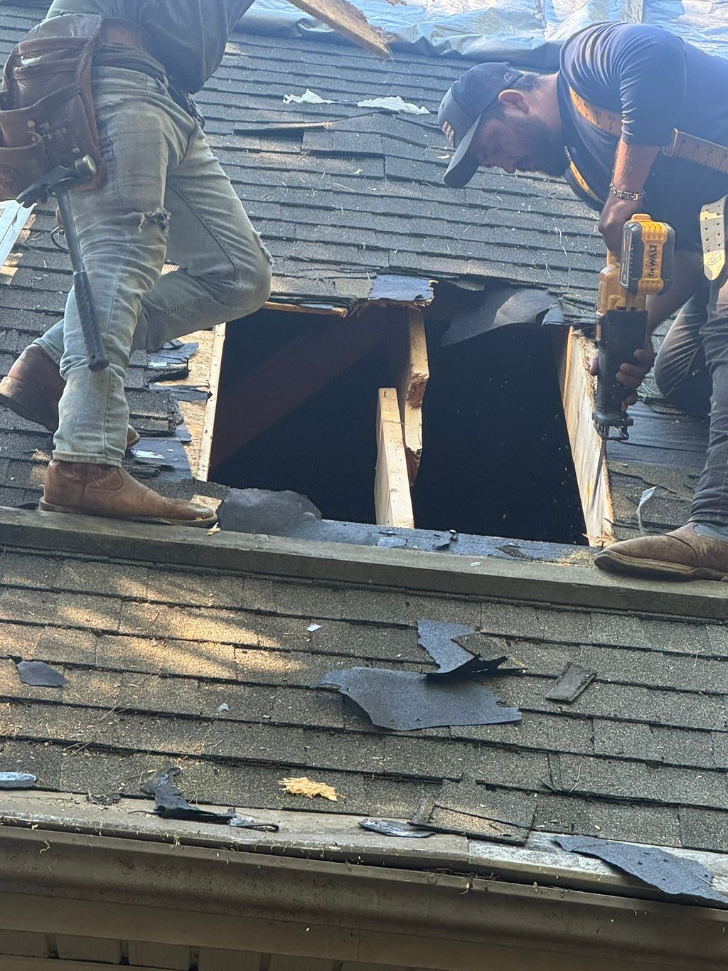 Roof repair after a tree  hit the main roof of the