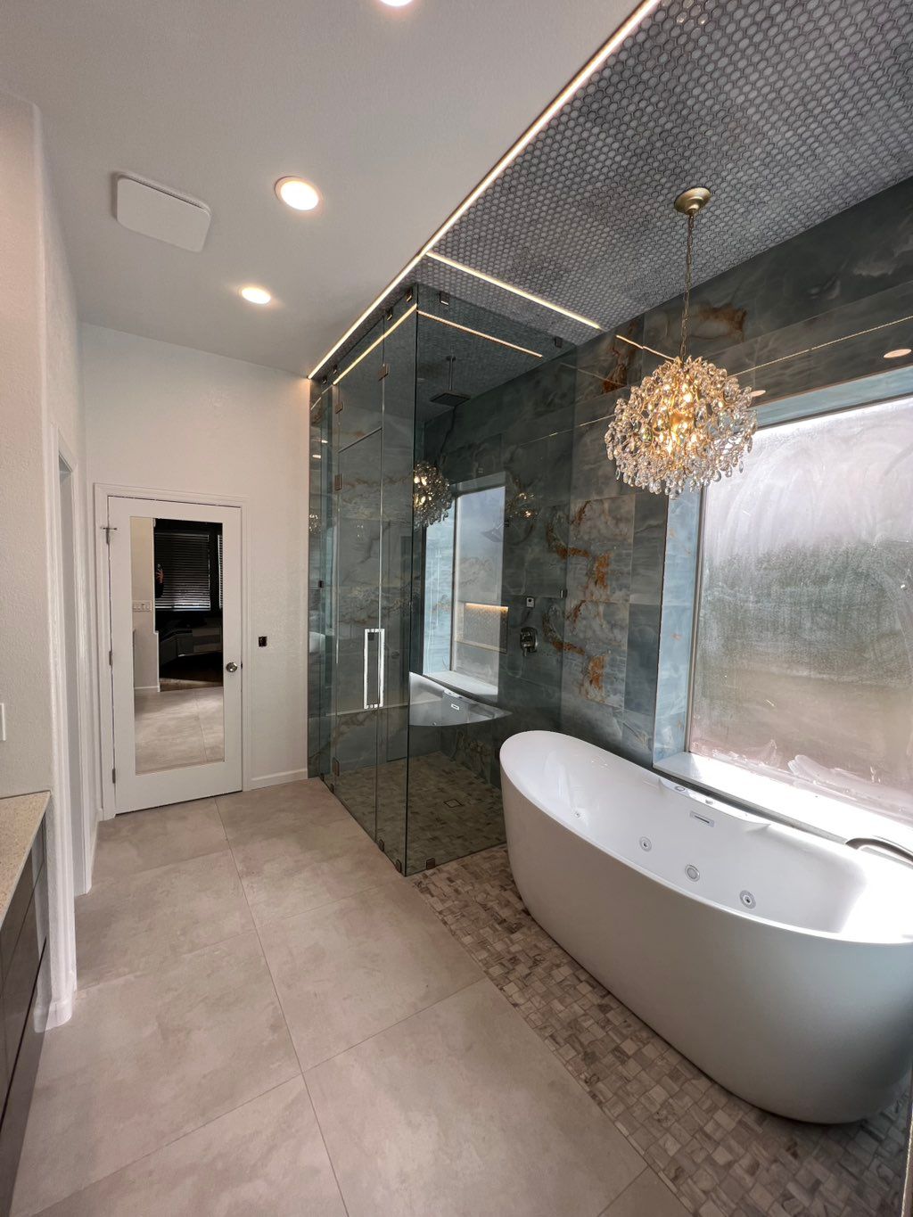 Ground up steam shower and whirlpool tub