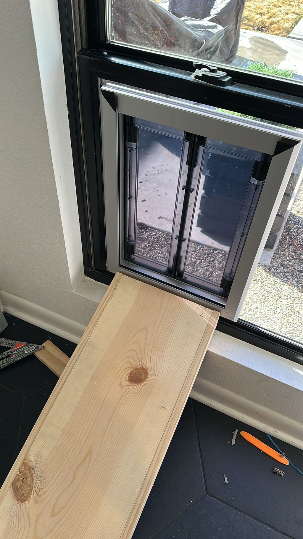 Pet door installed on a double pane glass