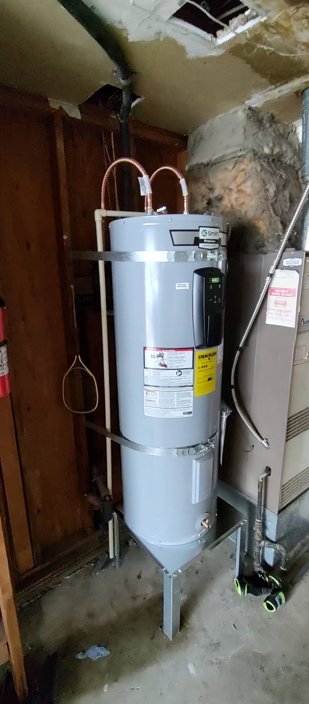 A brand new water heater and stand installed and b