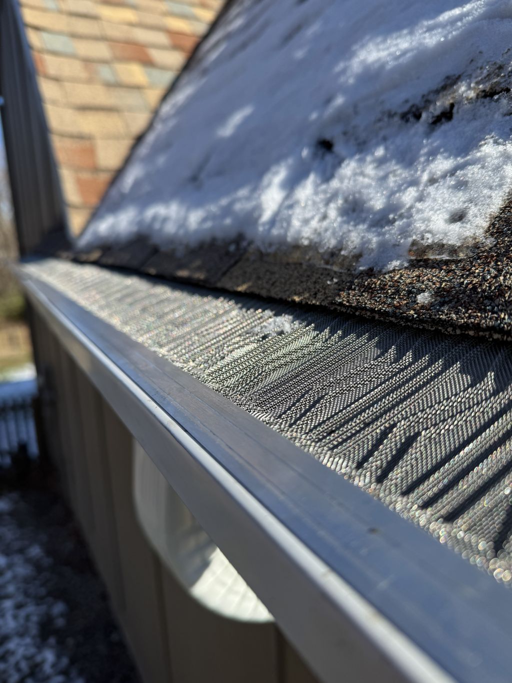 New stainless mesh gutter guards installed