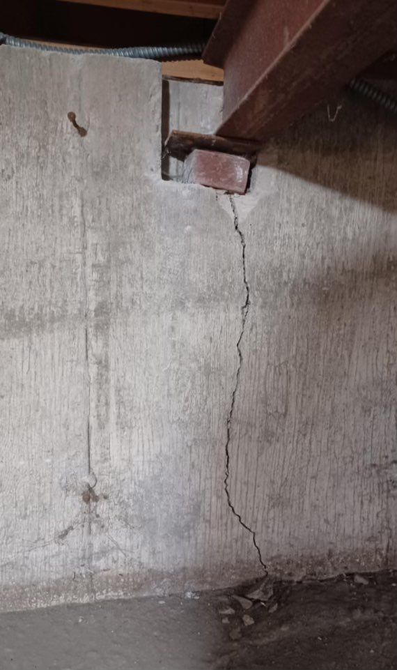 Cracked foundation at support beam 