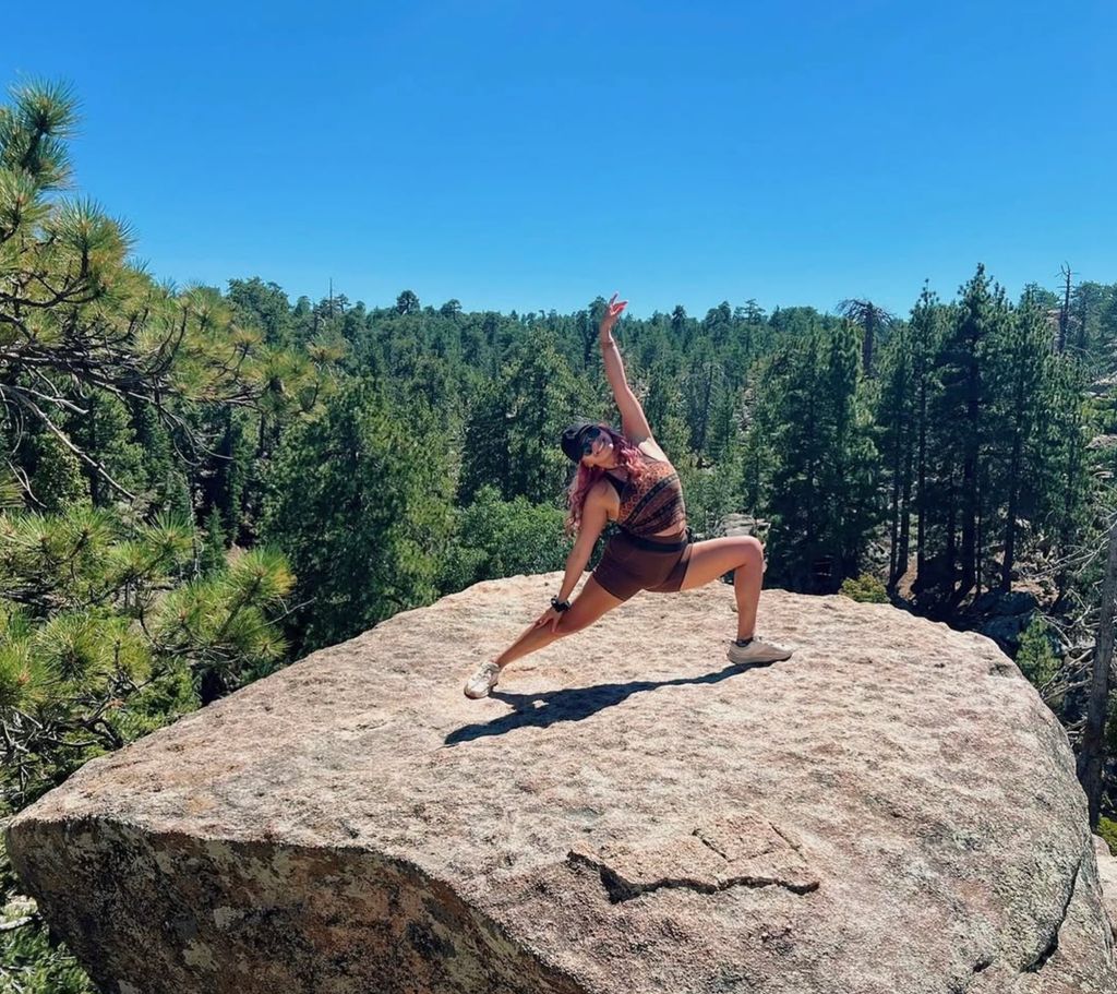 Reverse warrior on a mountain hike