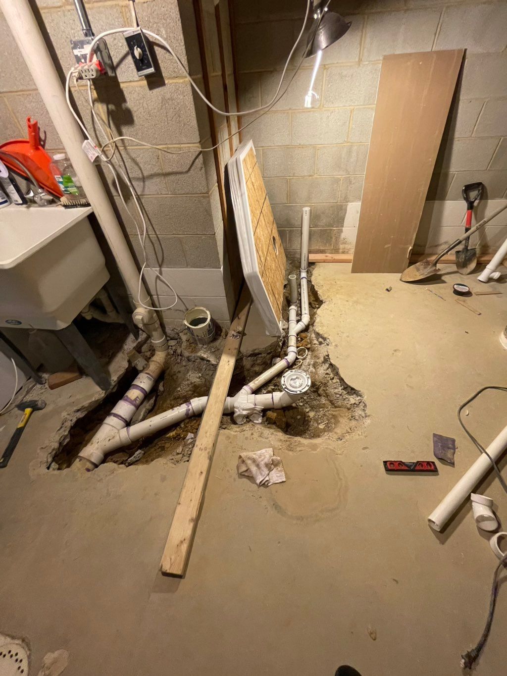 Adding toilet sewer plumbing connection in the bas