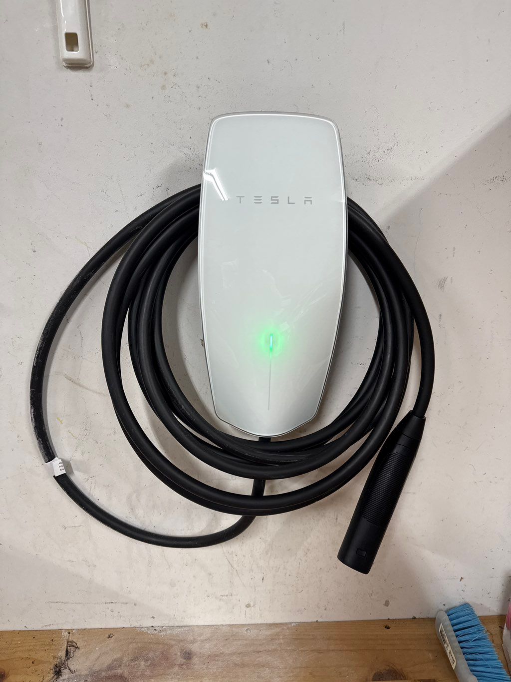 They installed a Tesla charger. Ran 220 V line abo