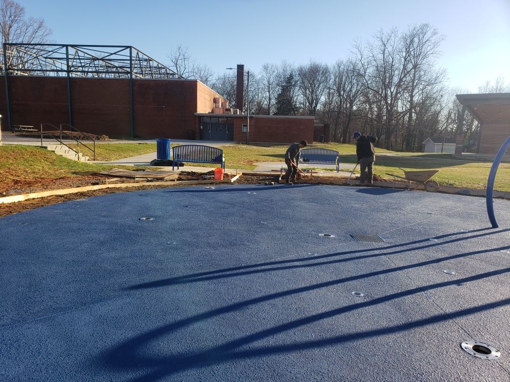 solid blue concrete coating, sealed with a wet loo