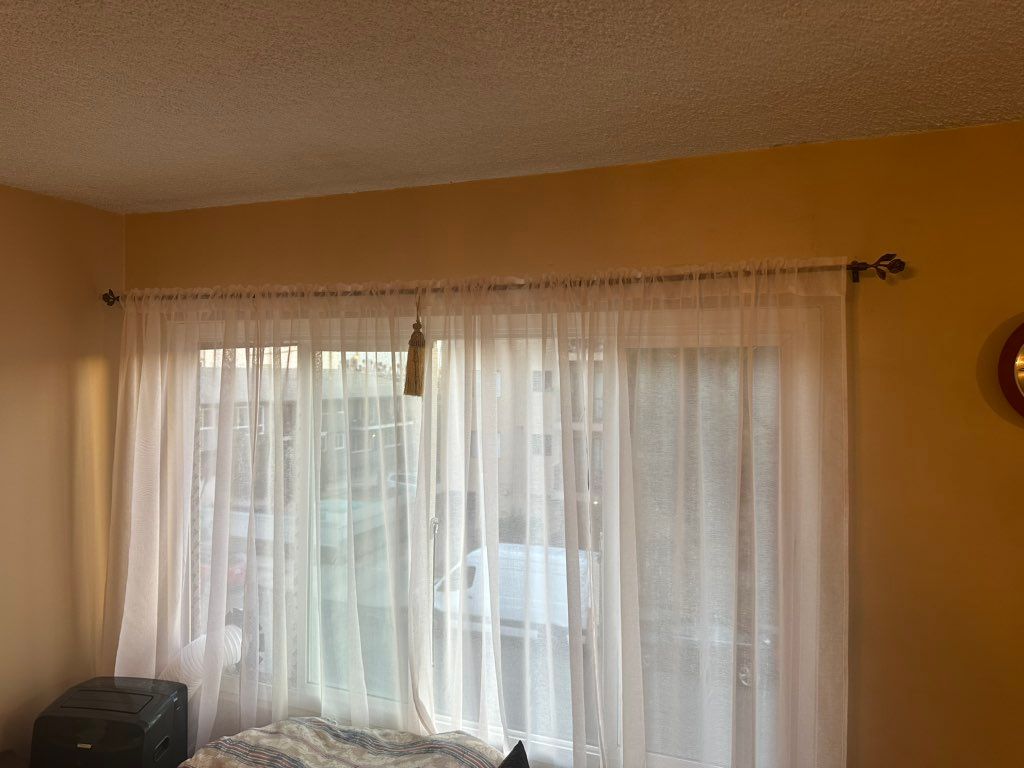 I hung the curtain rods and curtains.