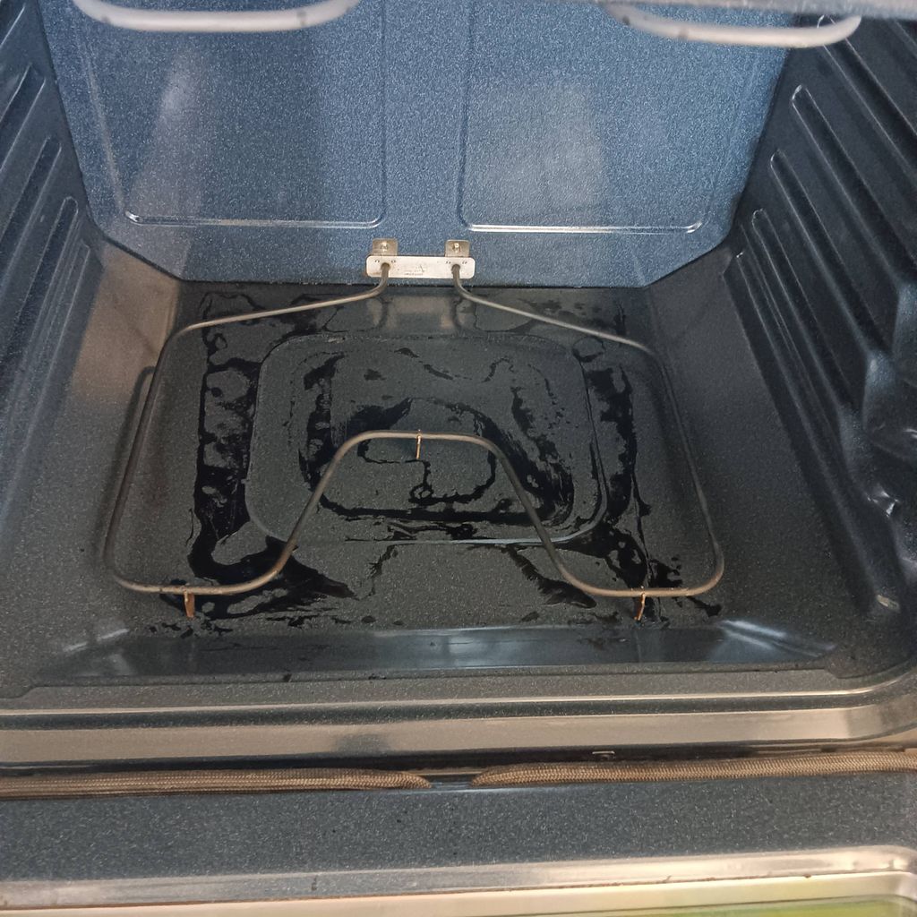 Oven cleaning in a home in Garland, Texas.