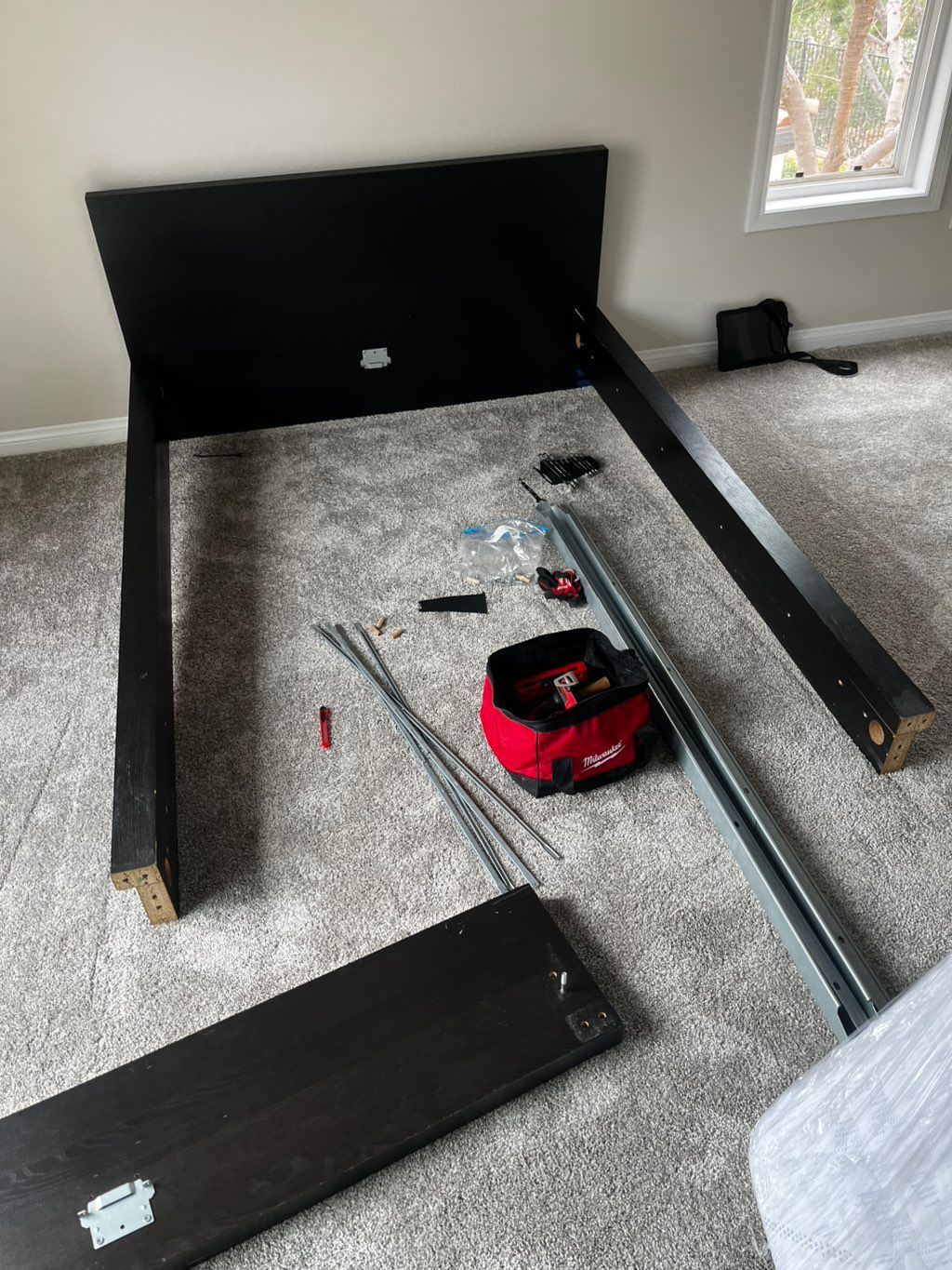 In the process of assembling a bed.